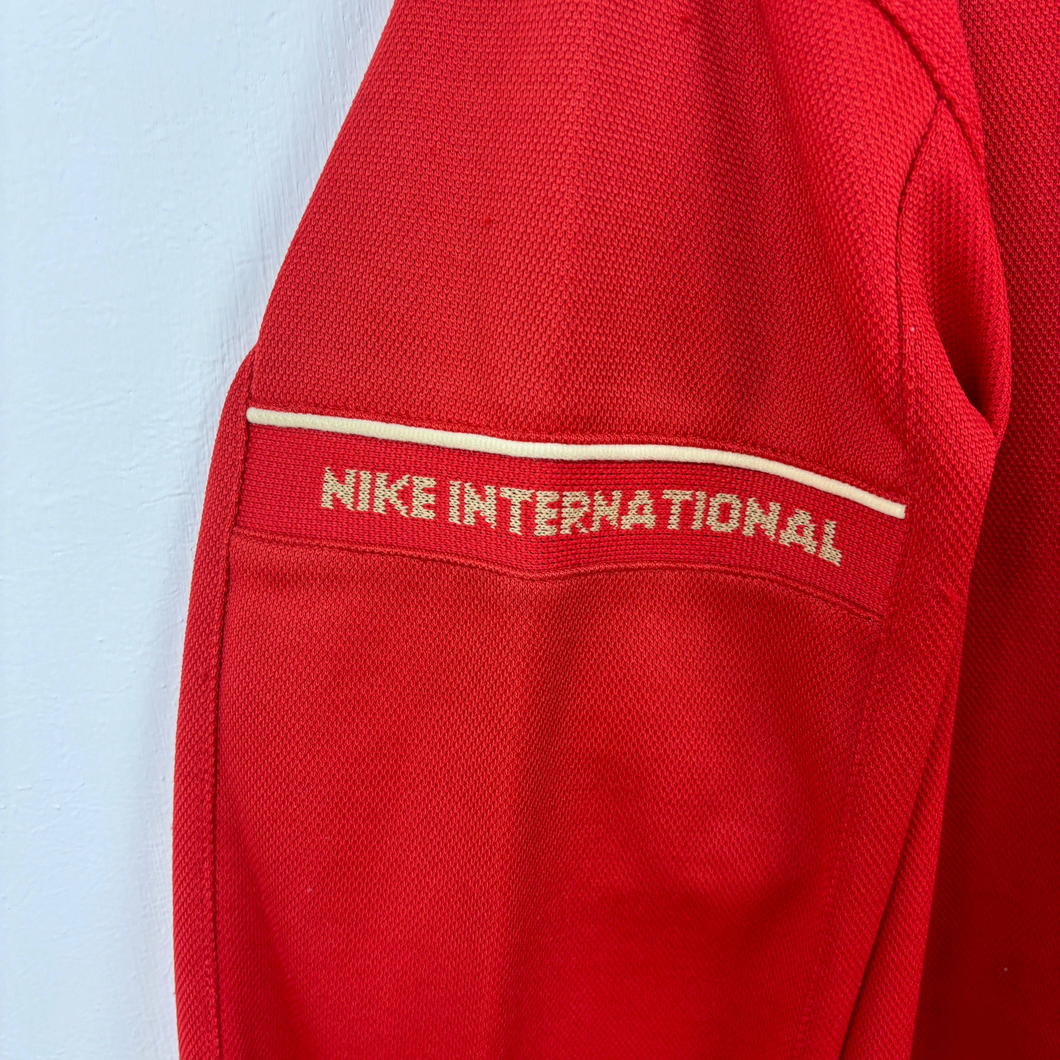 NIKE Track Jacket red goldline.