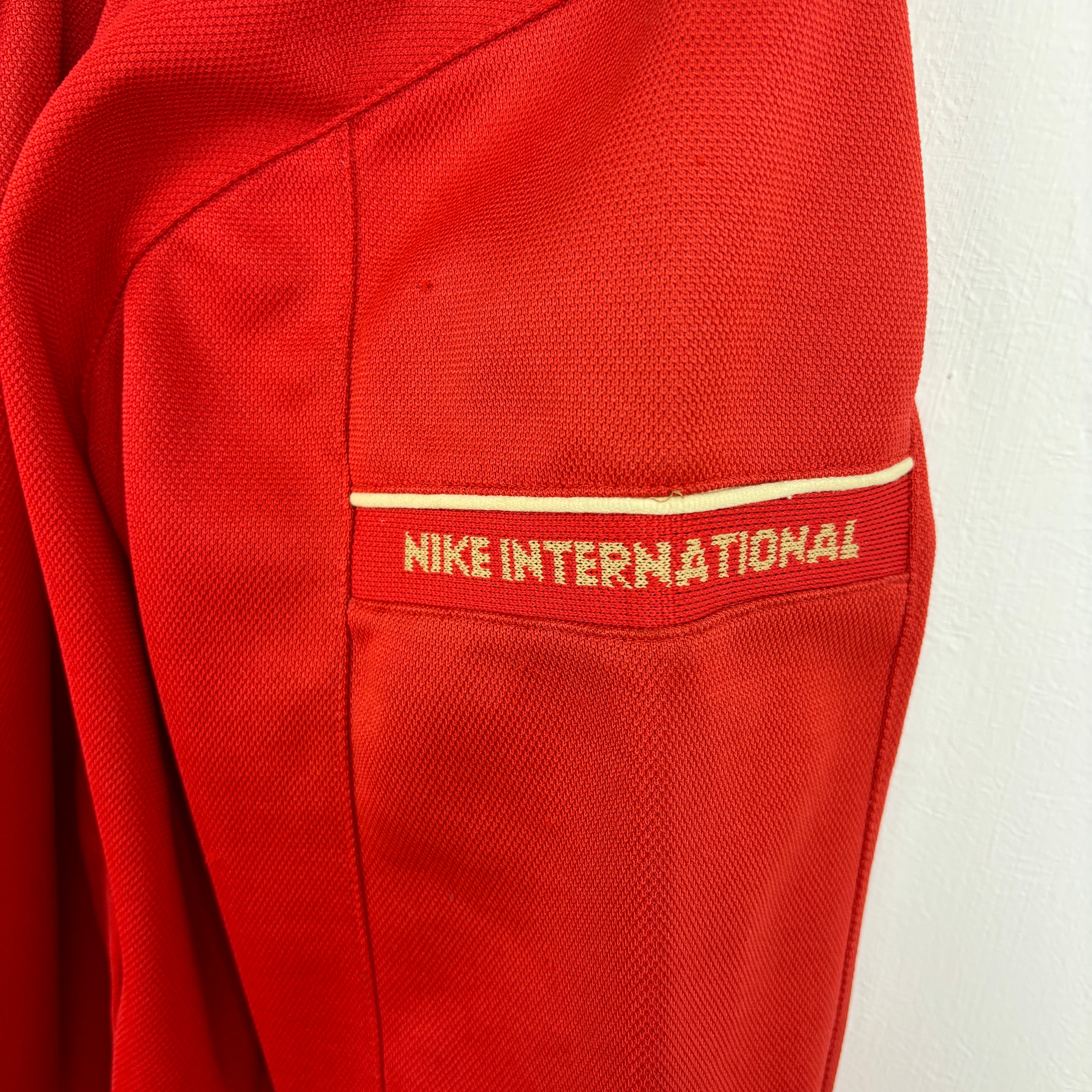 NIKE Track Jacket red goldline.